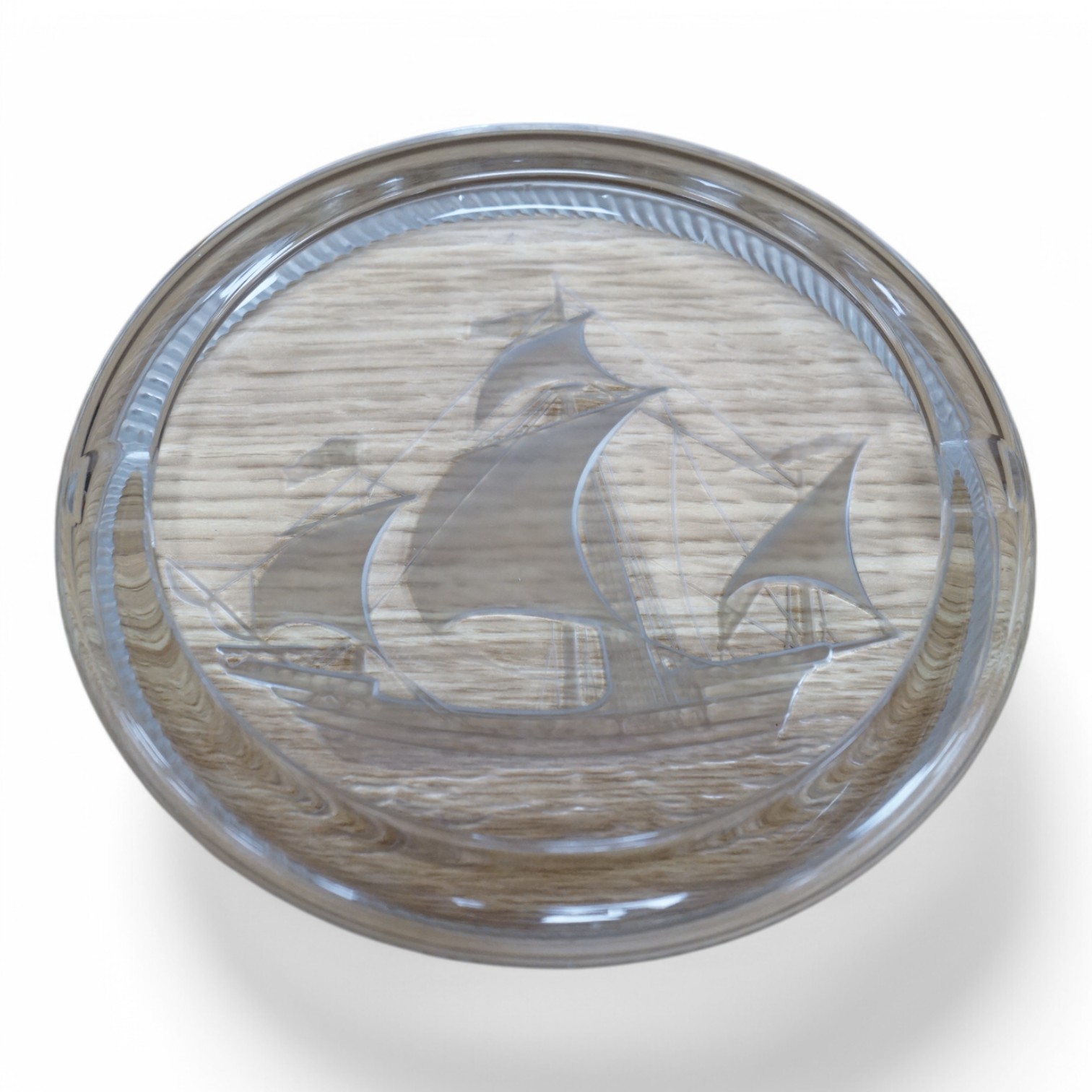 A modern Lalique ashtray decorated with a ship, signed to the base, 17cm in diameter. Condition - good